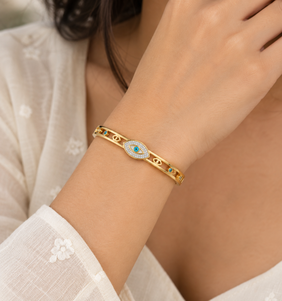 Gold-Tone Evil Eye Bangle Bracelet with Crystal Heart-Eye Design